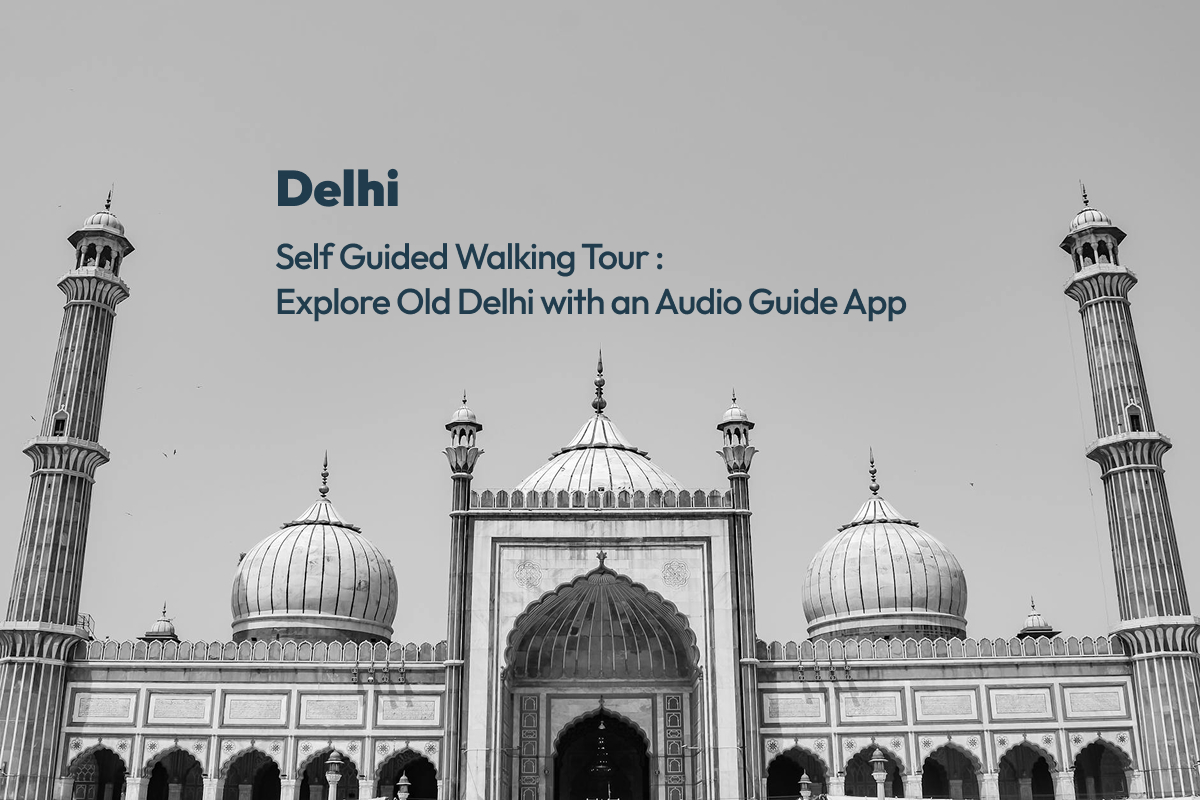 Jama Masjid facade in black and white with text overlay for a Delhi self guided walking tour with an audio guide app