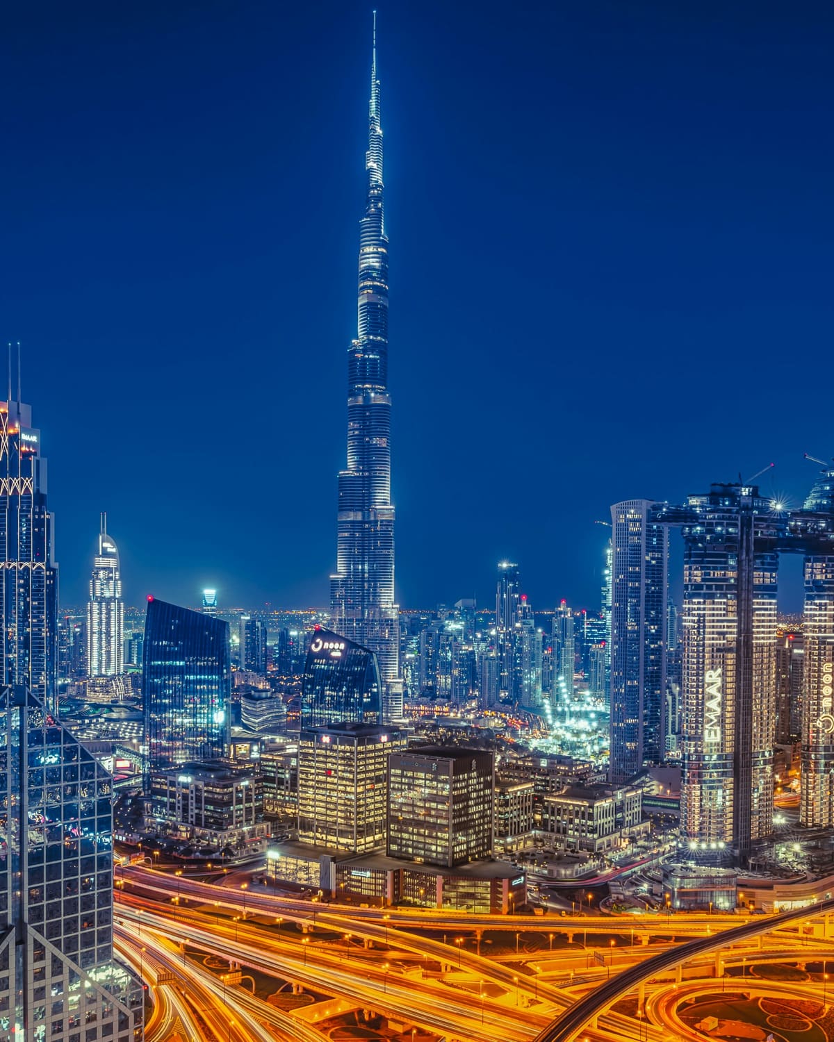 Burj Khalifa and the Downtown Dubai skyline at night, explored with a self-guided audio tour
