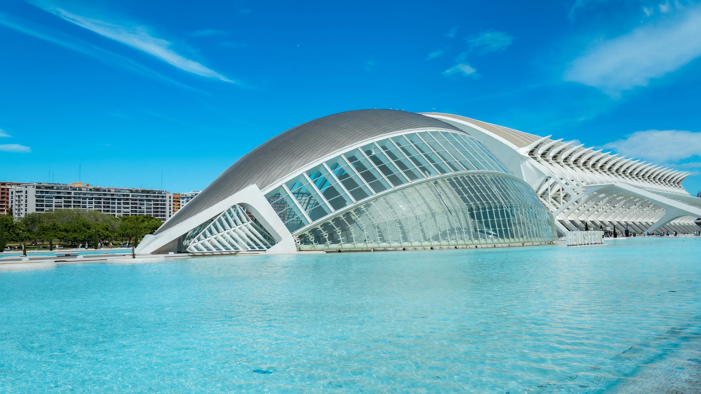 València walking audio tour L’Hemisfèric reflected in the pools of the City of Arts and Sciences in València, Spain