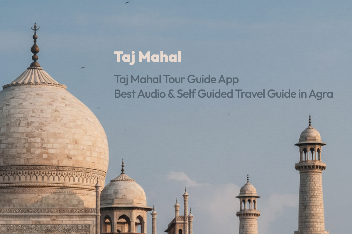 Tourist using smartphone with Taj Mahal tour guide app in front of the iconic marble mausoleum in Agra, India